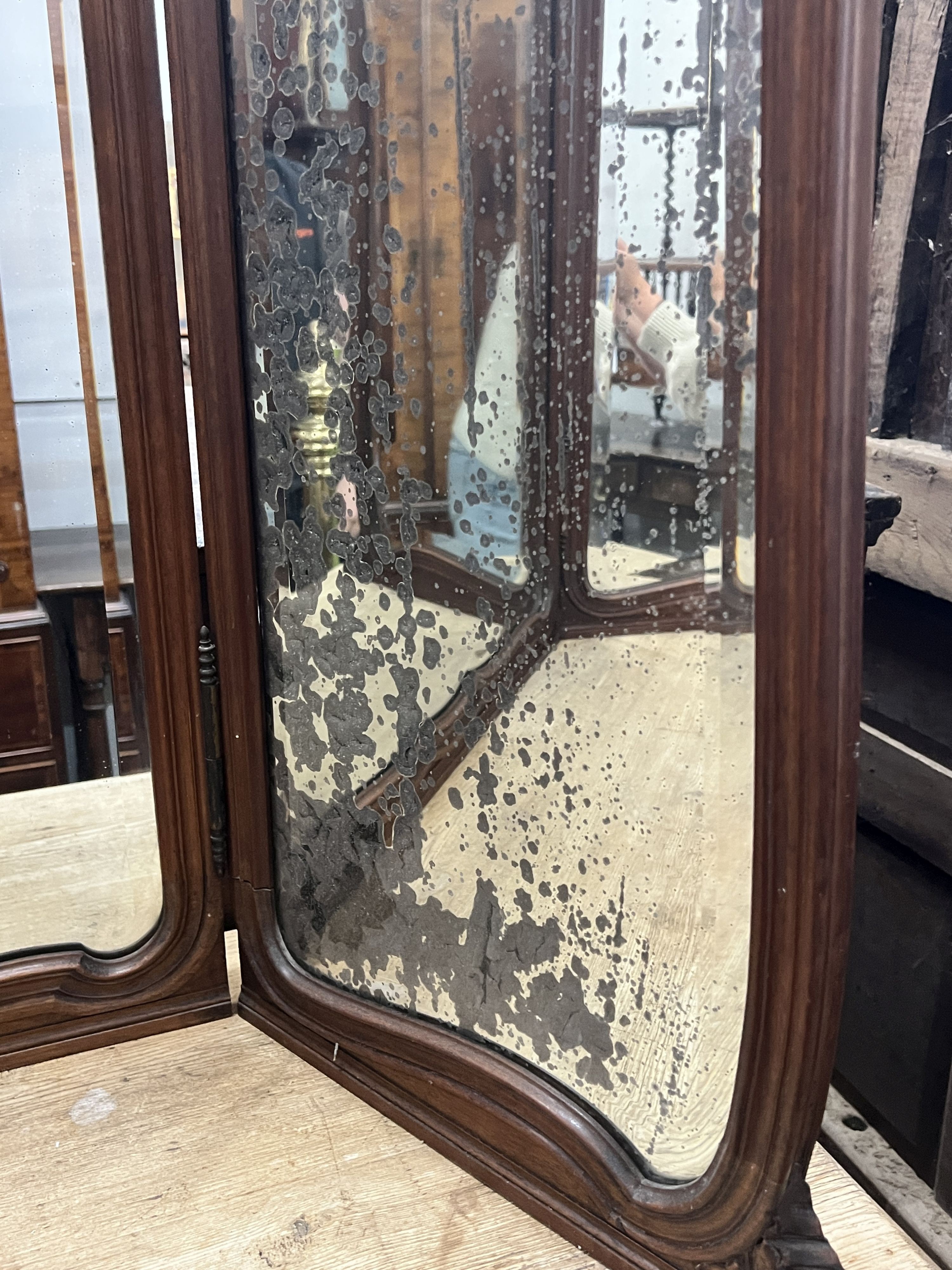 An early 20th century French carved walnut folding triple dressing table mirror, height 106cm